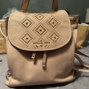 Light pink Michael Kors Backpack with gold accent and bead design
